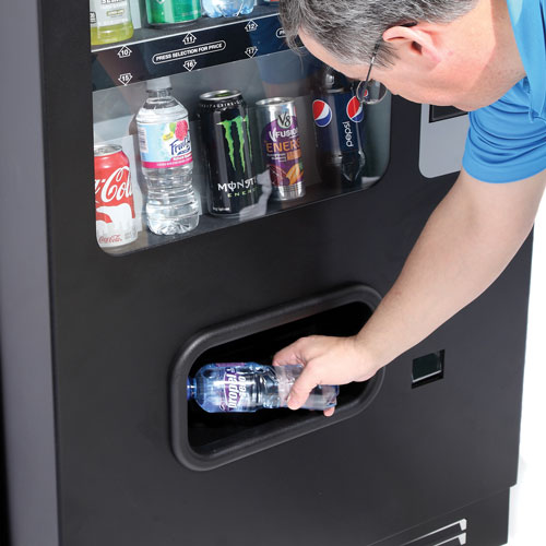 A vending customer retrieving Propel product from CB500 Gatorade Drink Vending Machine.
