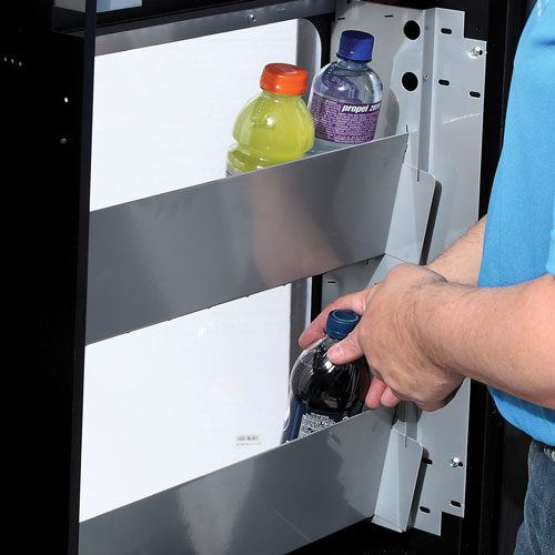 Vending operator loading the live drink display in the CB500 Gatorade Drink Vending Machine.